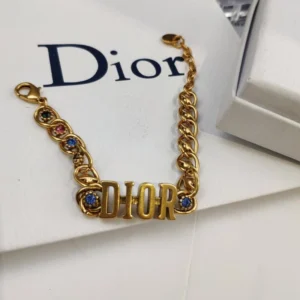 Alternative view of Linked chain Gold bracelet with J@D!0R cut out and Gems inlaid.