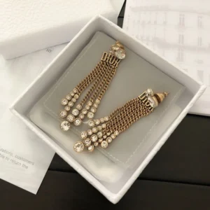 Alternative view of Golden Dangle earrings with gems and diamonds.