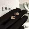 CD diamond inlaid stud earrings.