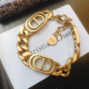 Linked chain gold bracelet with double CD cutout.