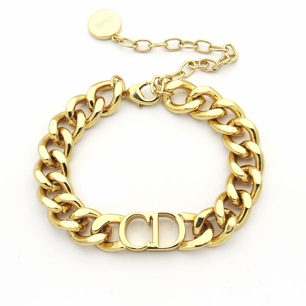 Linked chain gold bracelet with CD cutout.