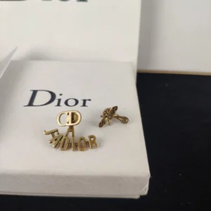 Alternative view of Diamonds inlaid Bee Stud earrings and brand logo cut out.