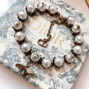 Alternative view of Antique touch gold bracelet with pearls and bee motif.