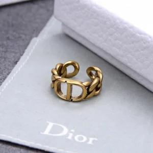 Linked chain gold ring with CD engraved on it.