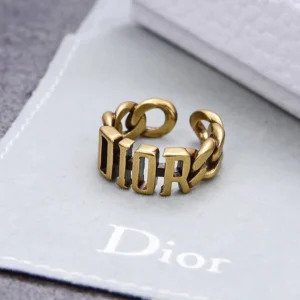 Linked chain gold ring with brand name engraved on it.
