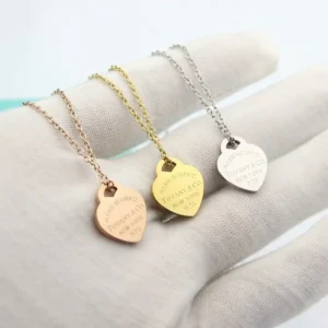 Alternative view of High quality heart necklace with brand name engraved on it.