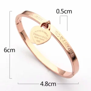 Alternative view of Smooth Bangle with heart shaped charm.