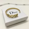 Gold bracelet/Bangle with J@D!0R cut out.