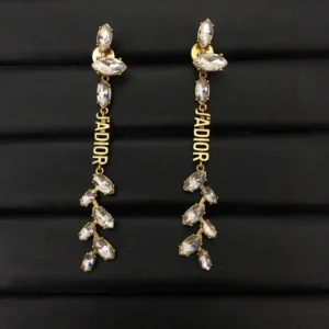 Dangle earrings with gems and diamonds J@D!0r cut out.