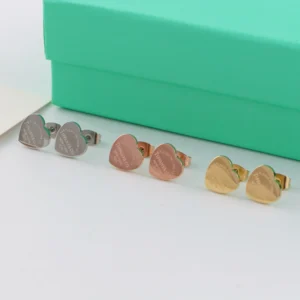 Heart-shaped stud earrings in  polished finish available in silver, rose gold, and yellow gold tones.