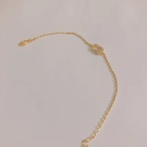 Linked chain Gold bracelet with pearls and diamonds inlaid and CD cut out.