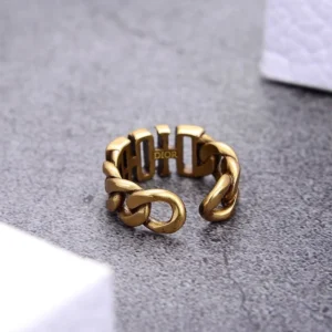 Alternative view of Linked chain gold ring with brand name engraved on it.