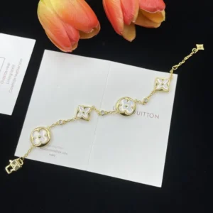 Alternative view of Bracelet is crafted from 18-karat yellow gold with diamonds and white mother-of-pearl blossoms.