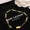 Golden linked chain bracelet with Y$L branding 18K gold plated.
