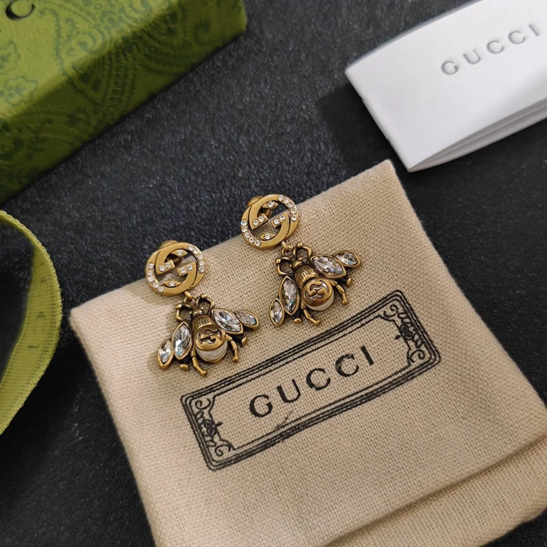 Golden Bee drop earrings with diamonds inlaid, giving a antique touch.