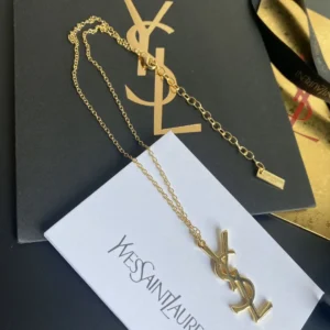 Alternative view of Golden linked chain necklace with metal cutout, adjustable chain.