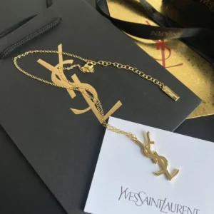 Golden linked chain necklace with metal cutout, adjustable chain.
