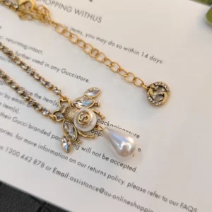 Alternative view of Diamond inlaid golden necklace with bee charm made pearls and diamonds.