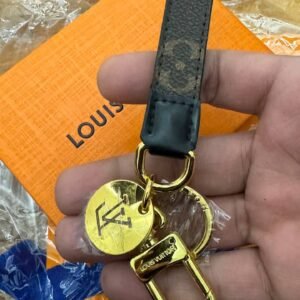 Alternative view of Leather key rings with box and papers.