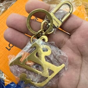 High quality golden key ring with metal cut out charm.