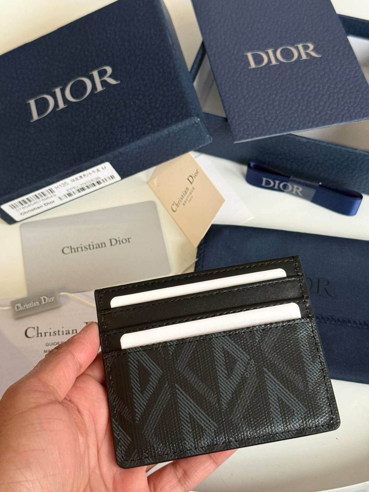 CD Diamond Card Holder featuring the signature geometric CD Diamond canvas pattern and black smooth calfskin trim.